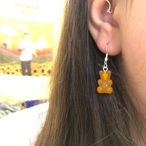 Orange gummy bear earrings.